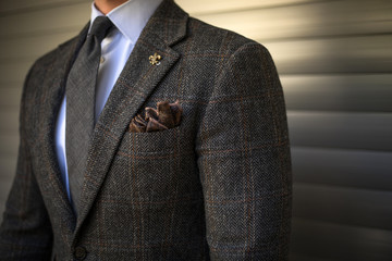 Detail of man in custom tailored suit posing