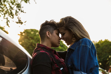 Lesbian Couple Kissing in Car - Sunset Time