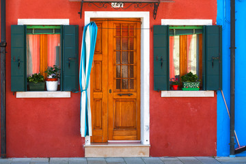 Colourfully painted house facade on Burano island, Italy