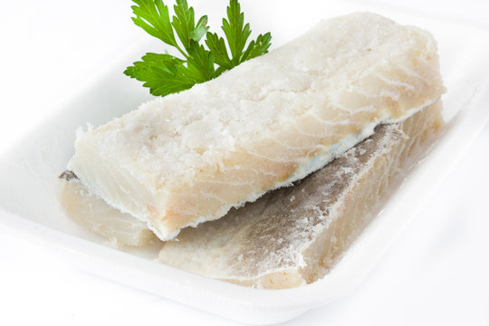 Salted dried cod isolated on white background. Typical Easter food

