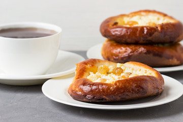 Homemade pies with cottage cheese and  tea.