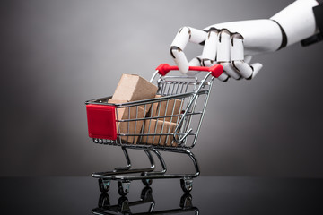 Robot Holding Shopping Cart With Cardboard Boxes