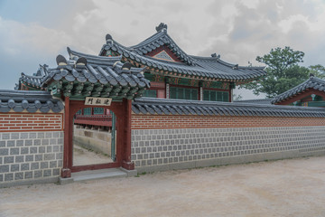 decorative wall, a fancy entry way, with tiled roof, and other fancy rooftops, in Gyeongbokgung Palace, Seoul, South Korea