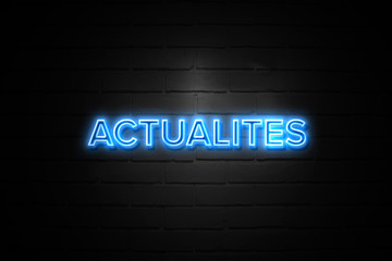 Actualites neon Sign on brickwall