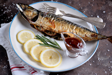 Fresh mackerel baked with rosemary, parsley, onion and lemon.