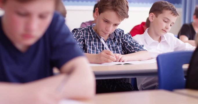 4k, Students taking a test in a classroom. Slow motion