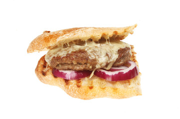 Cheeseburger and red onion in ciabatta
