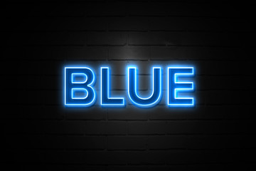 Blue neon Sign on brickwall