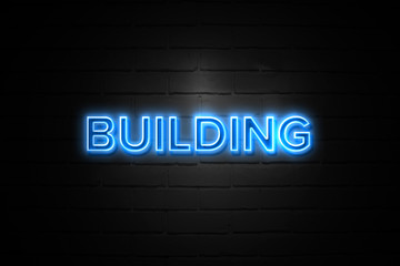 Building neon Sign on brickwall