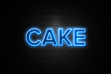Fototapeta na wymiar Cake neon Sign on brickwall