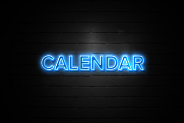 Obraz premium Calendar neon Sign on brickwall