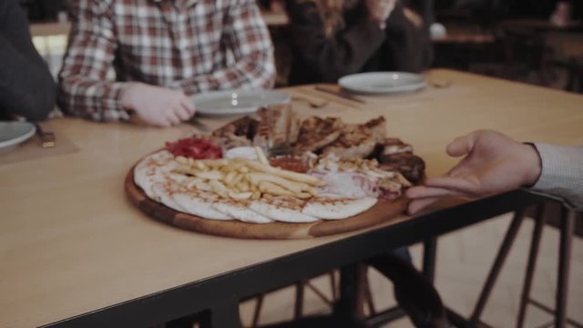 Meat plate with steak, souces and fries