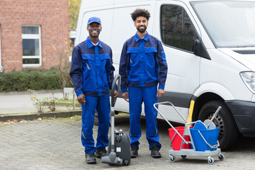 Portrait Of Two Happy Male Janitor