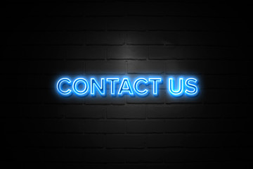 Contact Us neon Sign on brickwall