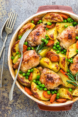 Chicken meat, thighs baked with potato, carrot and green peas