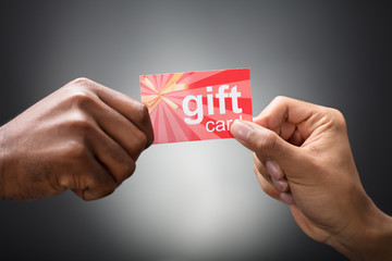 Two Hands Holding Gift Card