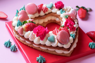 Pink cream cake with macaroons.