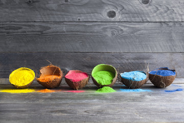 Festival of colors. Bright colors for holi festival. Colorful holi paint in coconut shells on a...