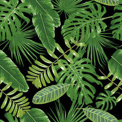 Fototapeta premium Shiny tropical leaves on a dark background. Seamless pattern.