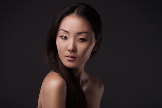 Beautiful Asian woman looking at camera