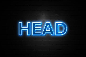 Head neon Sign on brickwall