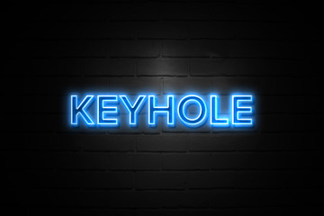Fototapeta na wymiar Keyhole neon Sign on brickwall