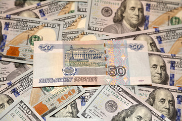 Parer american dollars and russian rubles bills 
