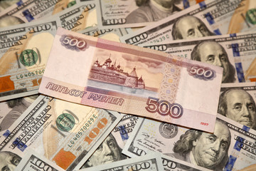 Parer american dollars and russian rubles bills 
