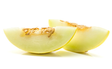 Yellow honeydew melon two slices with seeds isolated on white background.