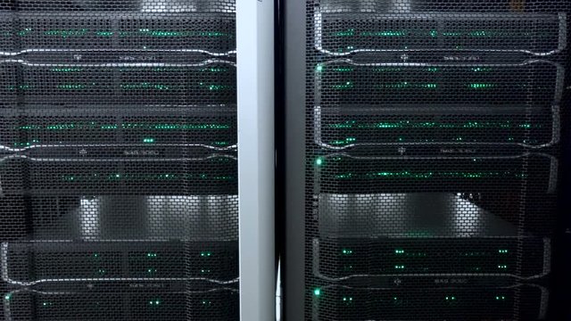 Server room. Web internet and network telecommunication technology, big data storage and cloud computing computer service business concept. Motion shot. flashing lights. Working data servers with flas