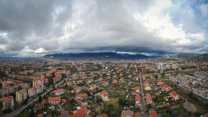 Flying between the town and stormy sky. Terni, Umbria, Italy/ Panorama 16:9