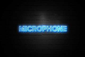 Microphone neon Sign on brickwall