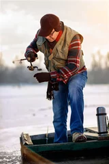 Foto auf Acrylglas Winter season-elderly man fishing © luckybusiness