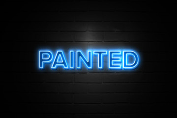 Painted  neon Sign on brickwall