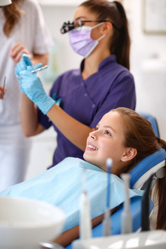 Girl on dental chair in dental ambulant