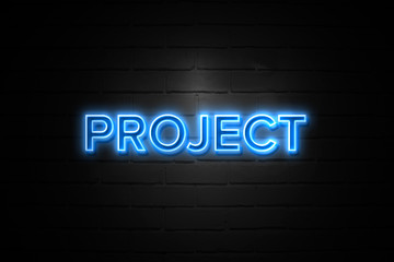 Project neon Sign on brickwall