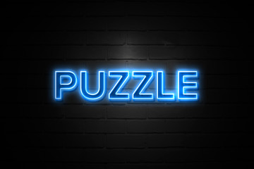 Obraz premium Puzzle neon Sign on brickwall