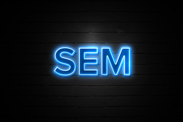 Sem neon Sign on brickwall