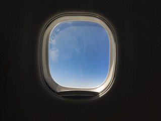 Airplane or jet window, travel and tourism concept.