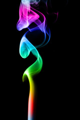 Abstract gradient colored smoke isolated on a black background for your design.