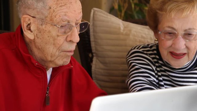 Elderly couple on computer 