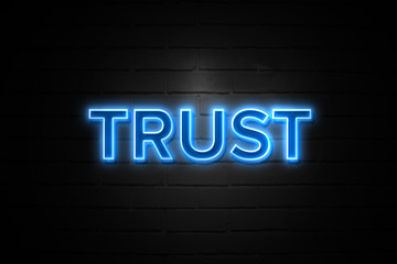 Obraz premium Trust neon Sign on brickwall