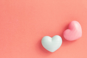 Couple of heart shape over red table. Romantic Valentine Day concept with copy space. Color filter.