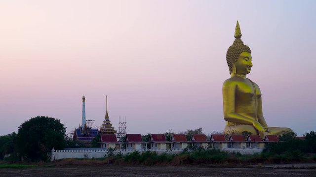 Big Buddha in Thailand with twilight sky at sunrise