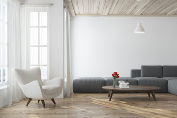 White living room with a gray sofa