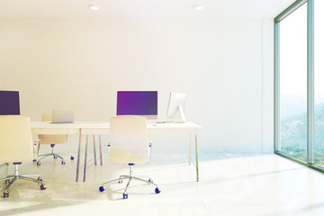 White office interior, computer screens toned