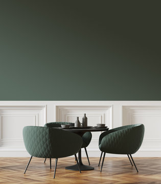 Black round table in a green and white cafe