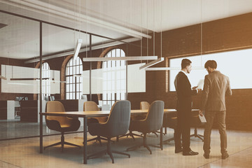 Brick meeting room corner, people
