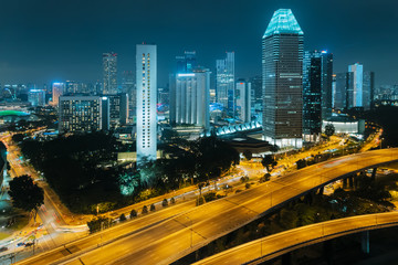 Fototapeta na wymiar Singapore city skyline. Aerial view to illuminated city at night