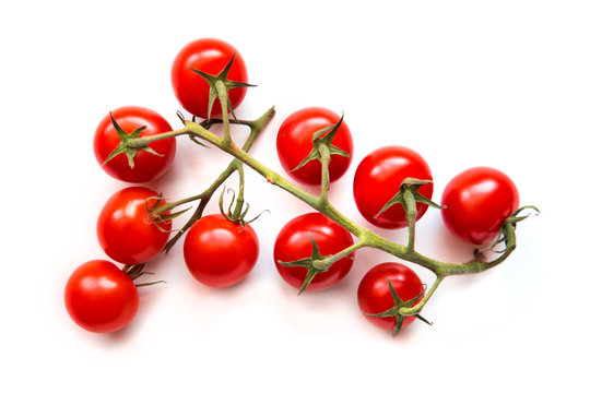 Ripe Cherry Tomatoes On Vine Against A Isolated White Background